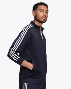 ADIDAS - GIACCA DA ALLENAMENTO PRIMEGREEN ESSENTIALS WARM-UP 3-STRIPES - H46100
