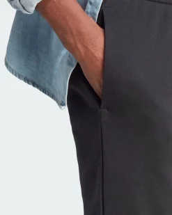 ADIDAS - PANTALONI ESSENTIALS FLEECE TAPERED CUFF BIG LOGO - IB4025