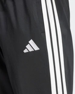 ADIDAS -  TUTA UOMO NERA CON 3 BANDE BIANCHE ESSENTIALS 3-STRIPES -JI8858