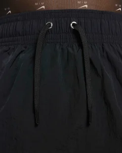 NIKE - Minigonna nera a vita alta con logo bianco e lacci