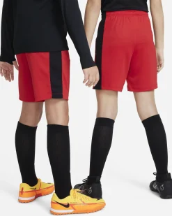 NIKE - Pantaloncini corti da bambino rossi in tessuto traspirante con logo bianco e bande laterali nere