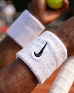 NIKE- POLSINO TERGISUDORE SWOOSH BIANCO CON DETTAGLI NERI, N.NN.04_101